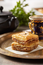 Oriental Dessert With Tea Cup On Plate