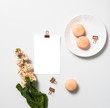 Social media flat lay with orange macaroons and postcard mock up
