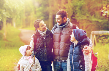 Wall Mural - happy family with backpacks hiking