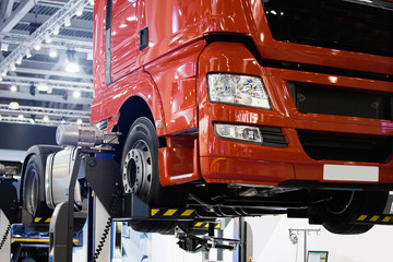 Poster - Truck on a lift in a car service