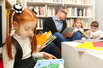 Wall Mural - Teacher and schoolchildren at library