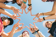 © MyMicrostock/Stocksy - Five smiling girls making a star