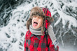 © Tara Romasanta Photography/Stocksy - child sticks tongue out to catch falling snowflakes