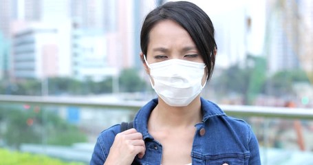 Wall Mural - Woman feeling sick and wearing face mask