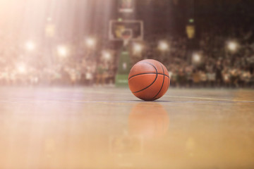 basketball ball in front of big modern basketball arena