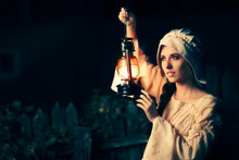 Medieval Woman With Vintage Lantern Outside At Night