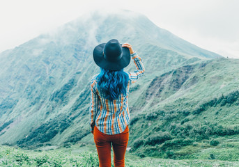 Sticker - Woman looking at mountains, rear view.