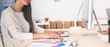 © shefkate - Young woman working in office, sitting at desk