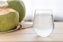 A Glass Of Coconut Water On Wooden Table