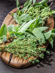 Fresh herbs on the wooden table.