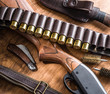 Pump action shotgun,12 guage cartridge and hunting knife.