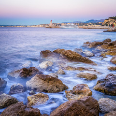 Wall Mural - The rough coast of the city Nice in France shot at first sunlight.