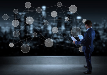 Poster - Businessman watching social network interface on a rooftop 3D rendering