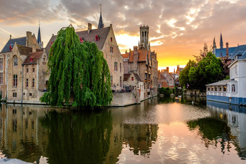 Wall Mural - Bruges (Brugge) cityscape with water canal at sunset