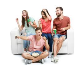 Wall Mural - Friends watching TV, isolated on white