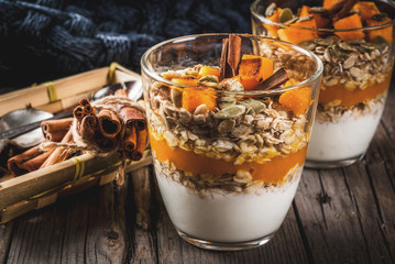 traditional autumn dishes, spicy pumpkin pie overnight oatmeal with cinnamon, anise and maple syrup.