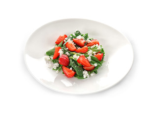 Wall Mural - Plate with strawberry spinach salad on white background