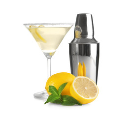 Sticker - Glass of lemon drop martini, shaker and fruit on white background