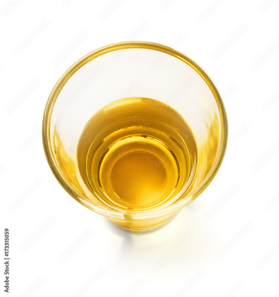 Glass with cooking oil on white background