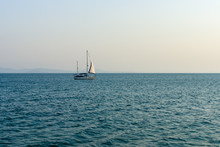 Lonely Sailboat On The Sea.