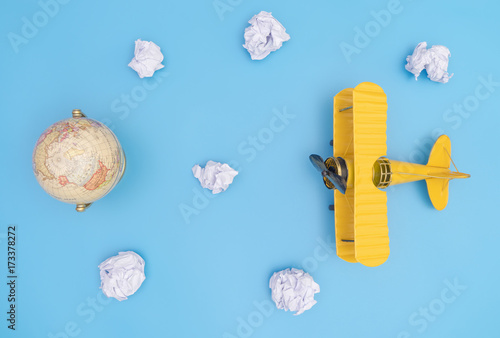 toy-metal-yellow-air-plane-for-world-travel-concept