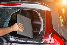 Hand Stealing Laptop From Back Side Of Car Which Rear Glass Broken