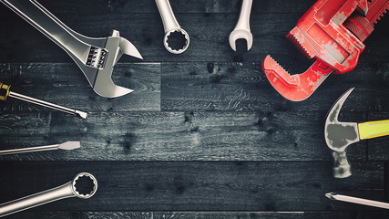 Tools placed on wooden floor.