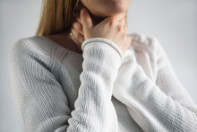 Sore Throat Of Woman.Touching The Neck