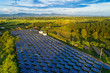 Top view of solar panels (solar cell) in solar farm with blue sky and sun lighting.Photovoltaic plant field.