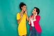 © Prostock-studio - Happy female friends listen to music at studio background