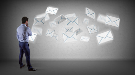 Wall Mural - Businessman using email interface on a wall 3D rendering