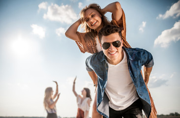 Wall Mural - Group of friends having fun at the beach