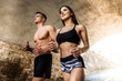 © HBS - Running is part of their daily routine.Shot of a young couple running together along a road.