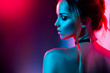 canvas print picture - Beautiful sexy girl with trendy make-up in colorful bright lights