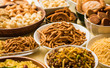 stock photo of  Diwali food or Diwali snacks or Diwali sweets like anarsa, bakarvadi, chakli, sev, bhujiya, shankar pale and chivda or chiwada, karanji, favourite indian diwali recipe