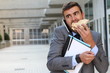 © ajr_images - Businessman eating a sandwich on the go