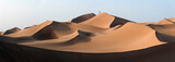 Fototapeta Nowy Jork - Photographer over the dunes