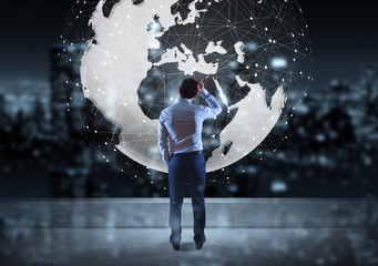 Poster - Businessman watching digital planet earth interface on a rooftop 3D rendering