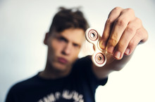 Teenager Holding Fidget Spinner, Focus On The Toy