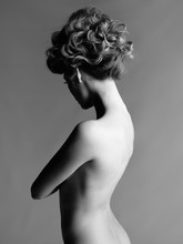 Nude Woman With Elegant Hairstyle On Gray Background