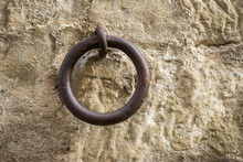 Old Iron Ring A Little Rusty Embedded In A Stone Wall, Used To Leave Tethered Animals Like Horses Or Mules, Vintage
