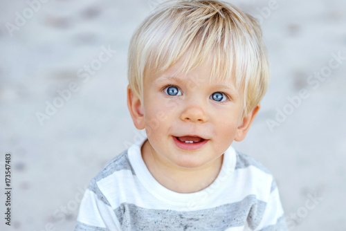 Cute Boy With Blond Hair And Blue Eyes Buy This Stock Photo And