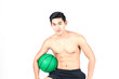 © suphaporn - fitness man holding a basketball on white background