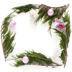 Wall Mural - Juniper branches with a Christmas decor. Christmas, New Year background. Square frame of coniferous branches of juniper. Top view, flat design.
