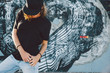 © Alena Ozerova - Model wearing plain tshirt and sunglasses posing over street wall