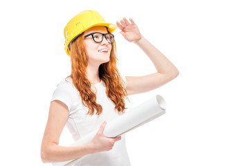 conceptual photo- woman builder looks to the future, portrait on white background