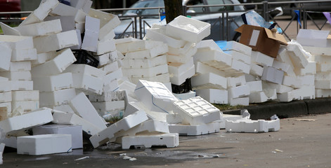 polystyrene boxes thrown after the market in a square