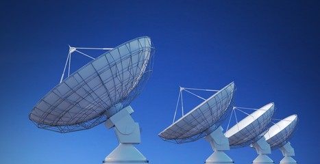 Wall Mural - array of satellite dishes or radio antennas against blue sky. 3d rendered illustration.