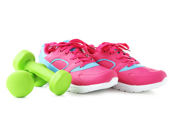 Wall Mural - Sport shoes with dumbbells isolated on a white background