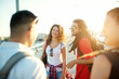 © dusanpetkovic1 - Group of young and cheerful travelers, enjoying the beautiful sunny day during a break on the bridge.
